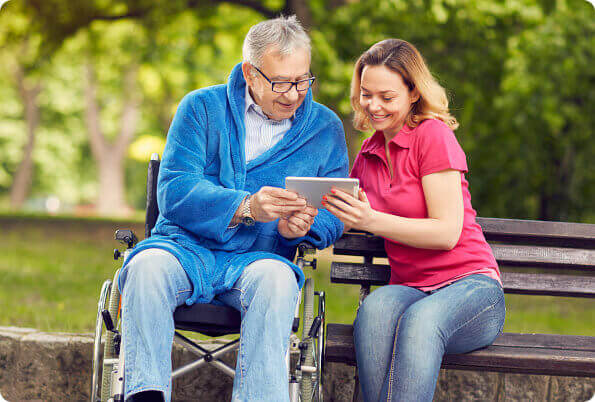 caregiver and patient using tablet